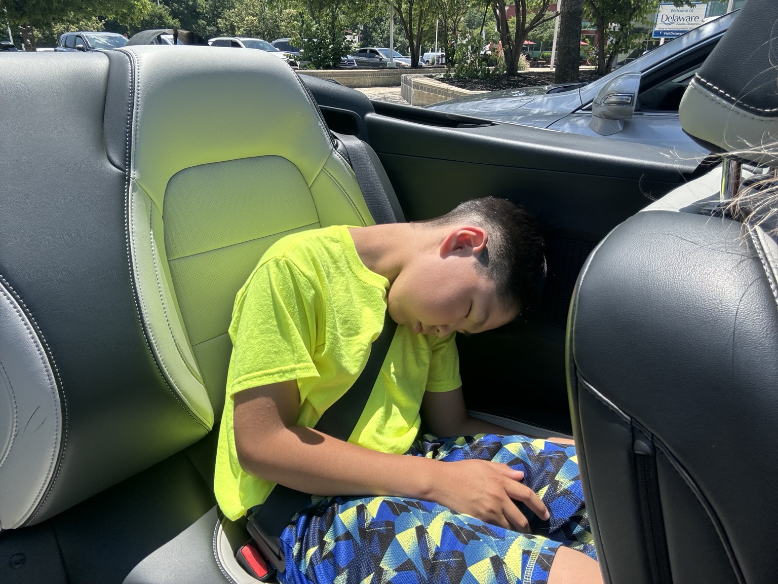 Lucas asleep in a car today