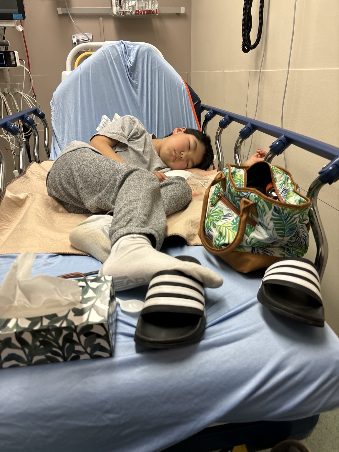 Lucas resting in a hospital bed