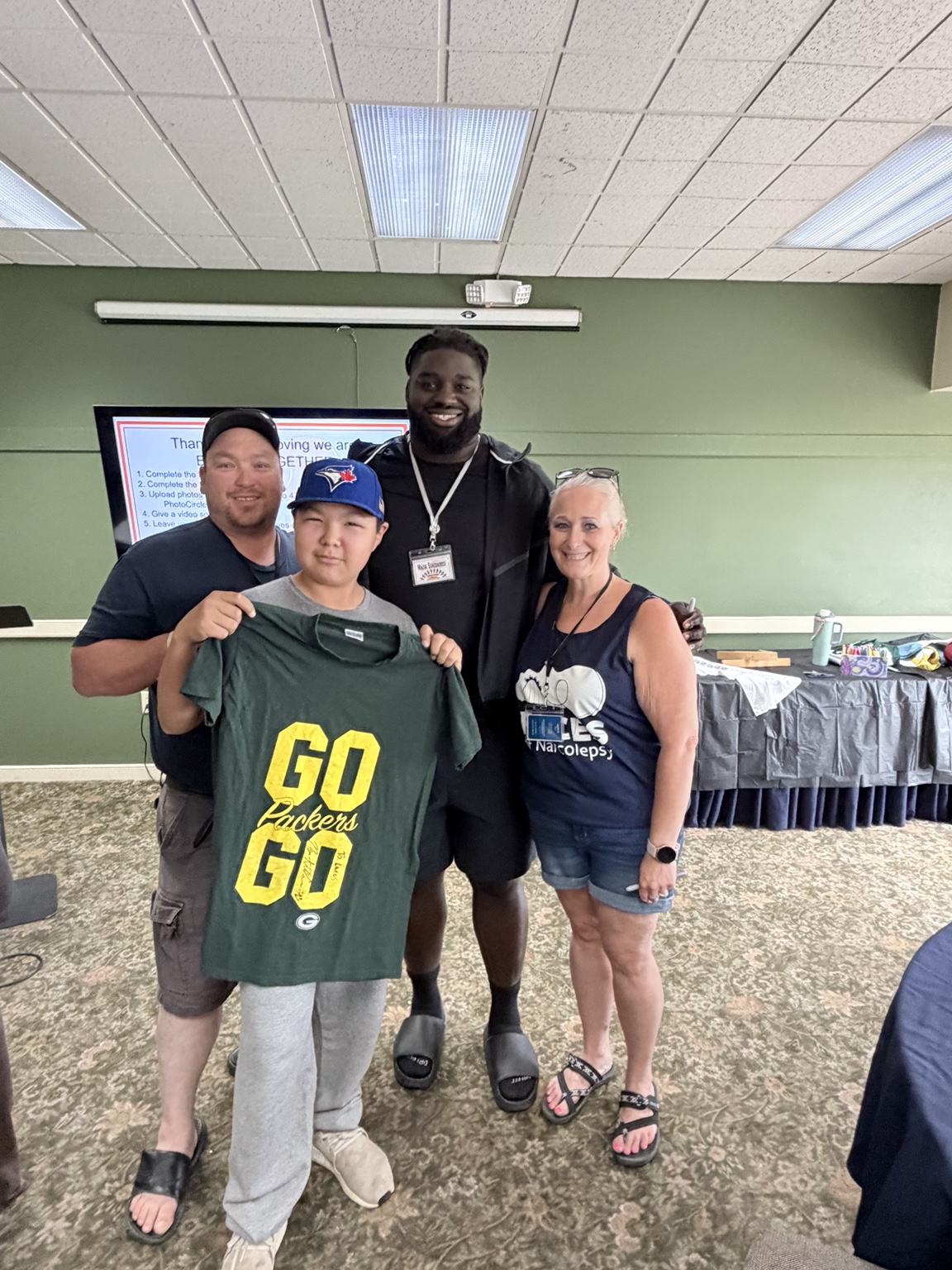 Lucas with family and a professional football player at Campference